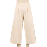 Wide leg pants with hot diamonds on the left ankle opening